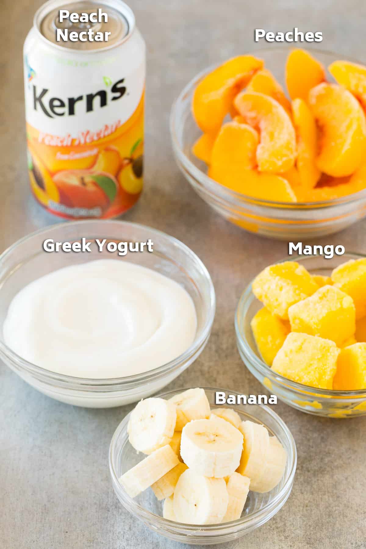 Ingredients including frozen fruit, yogurt and juice.