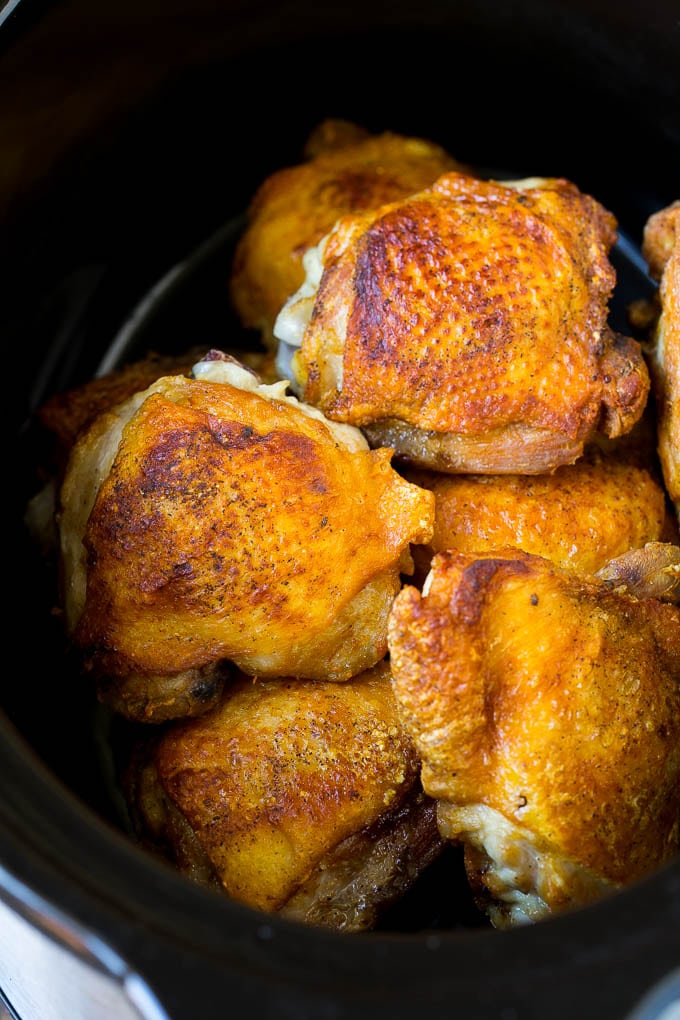 Browned chicken thighs in a crock pot.