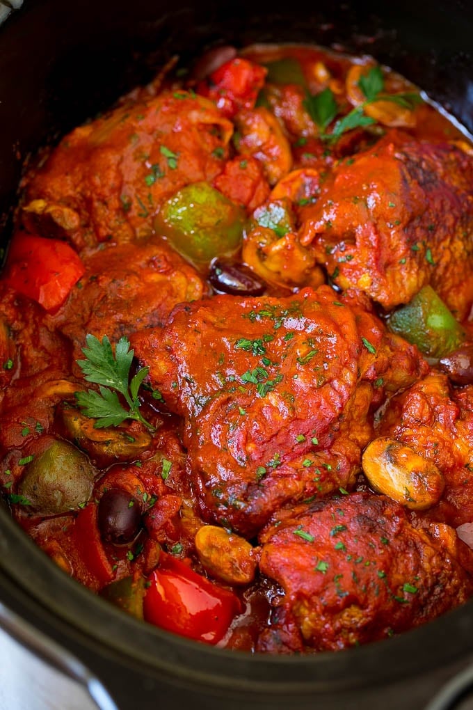 Slow cooker chicken cacciatore with mushrooms, peppers and olives.