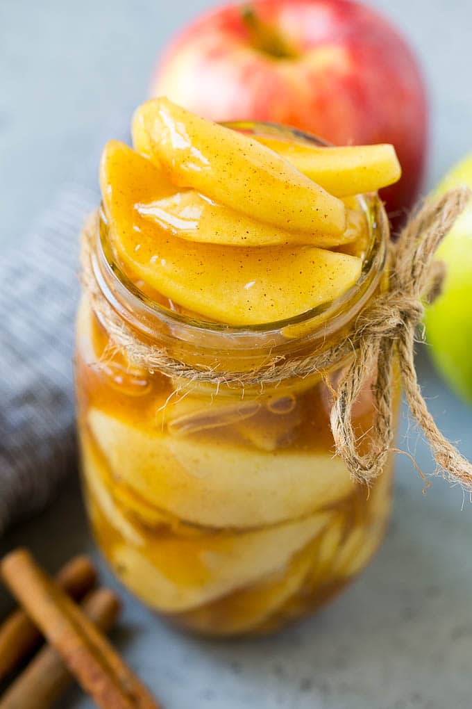 A mason jar filled with homemade apple pie filling.