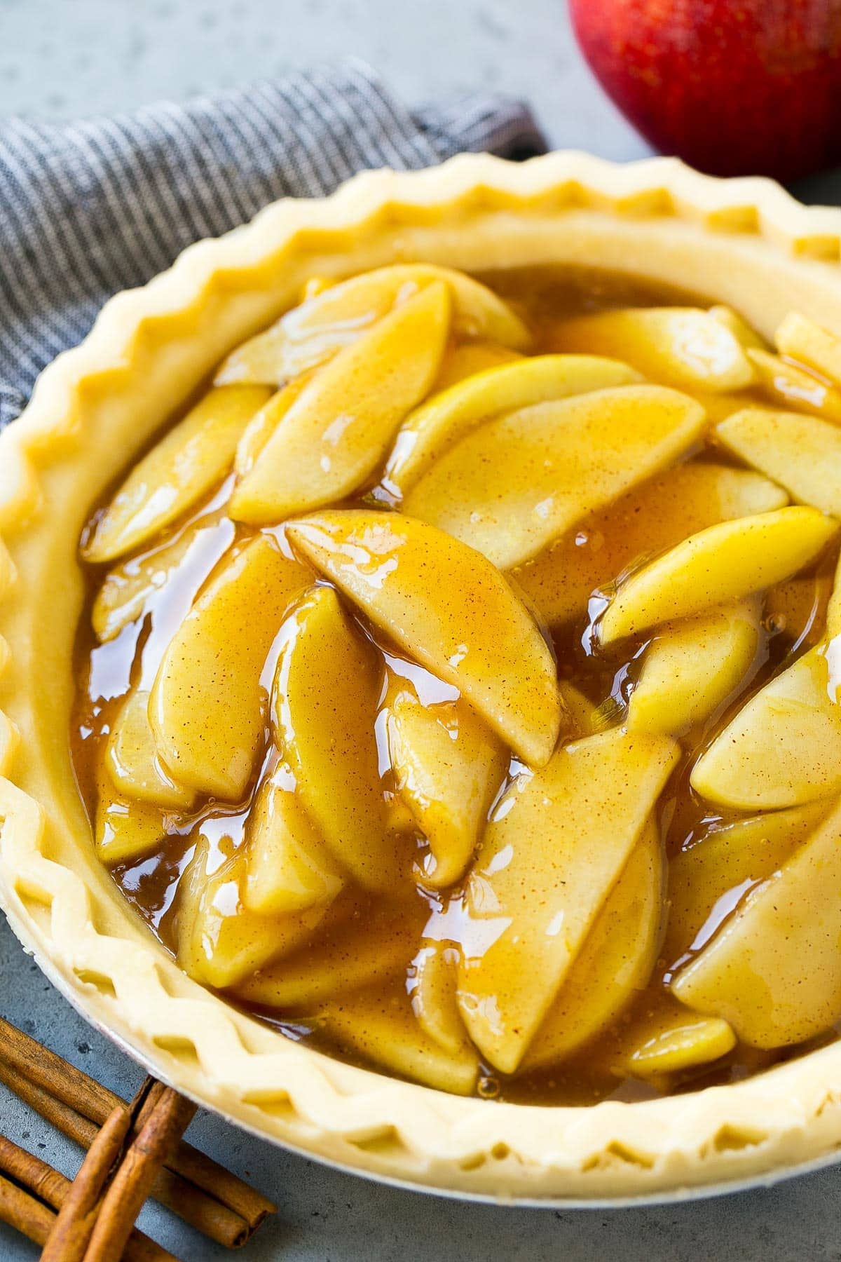 Apple pie filling in an unbaked pie crust.