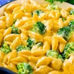 A skillet of broccoli mac and cheese in a creamy cheddar sauce.