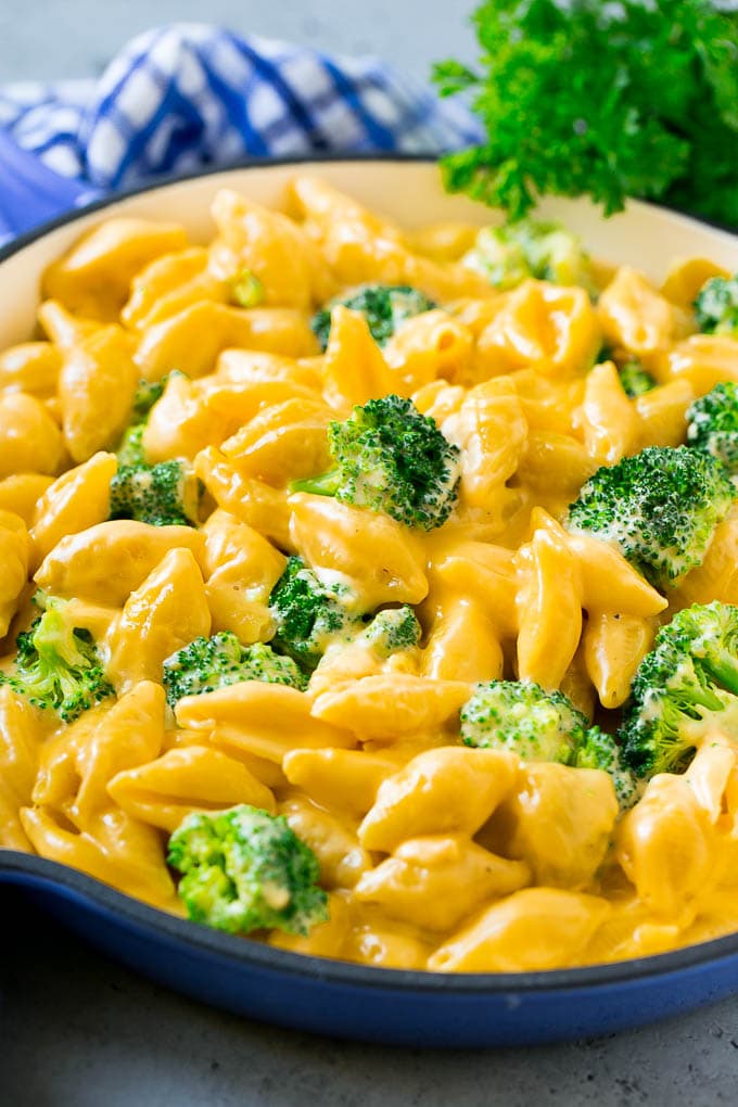 A skillet of broccoli mac and cheese in a creamy cheddar sauce.