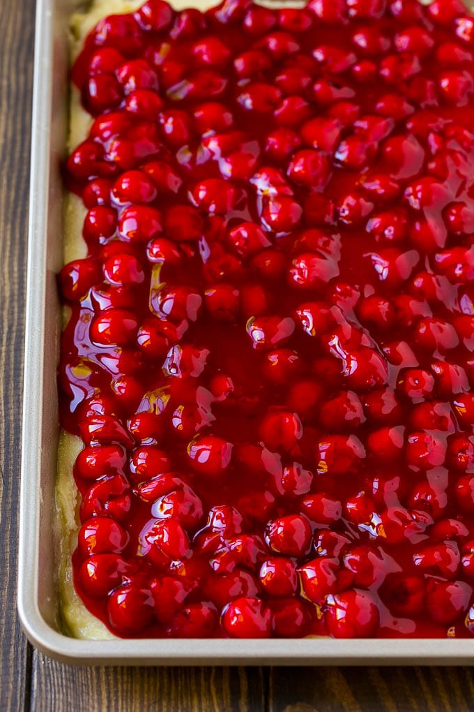Cherry pie filling spread over a cookie crust.