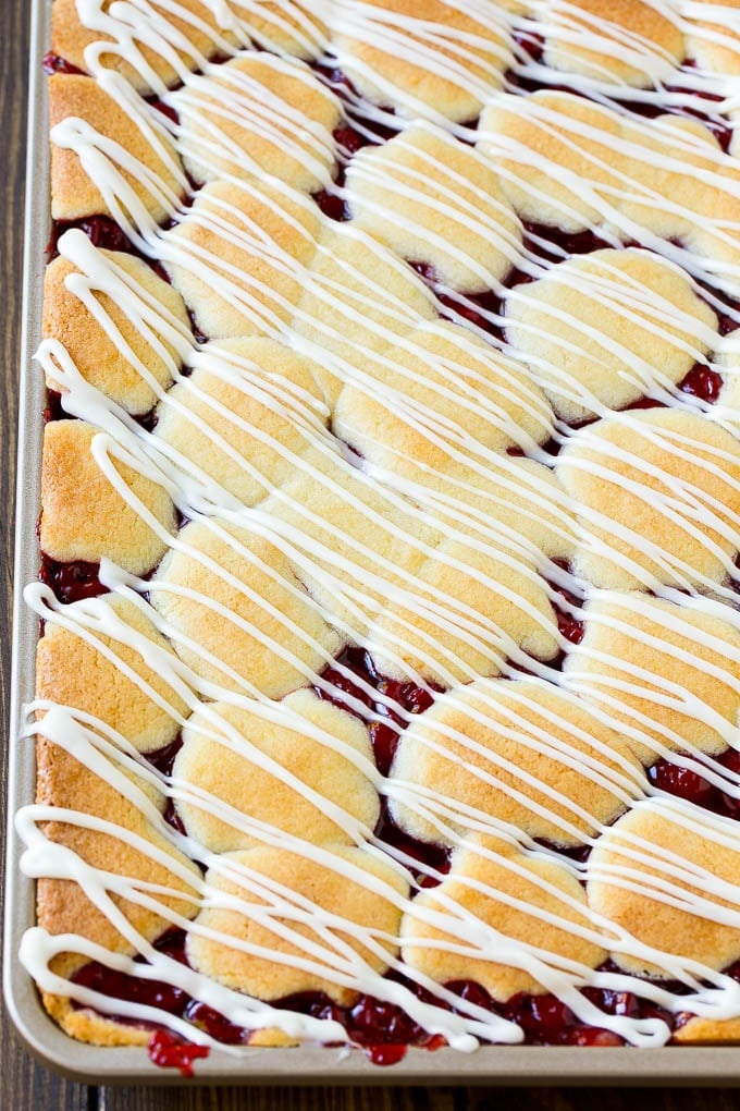 Cherry bars topped with vanilla glaze.