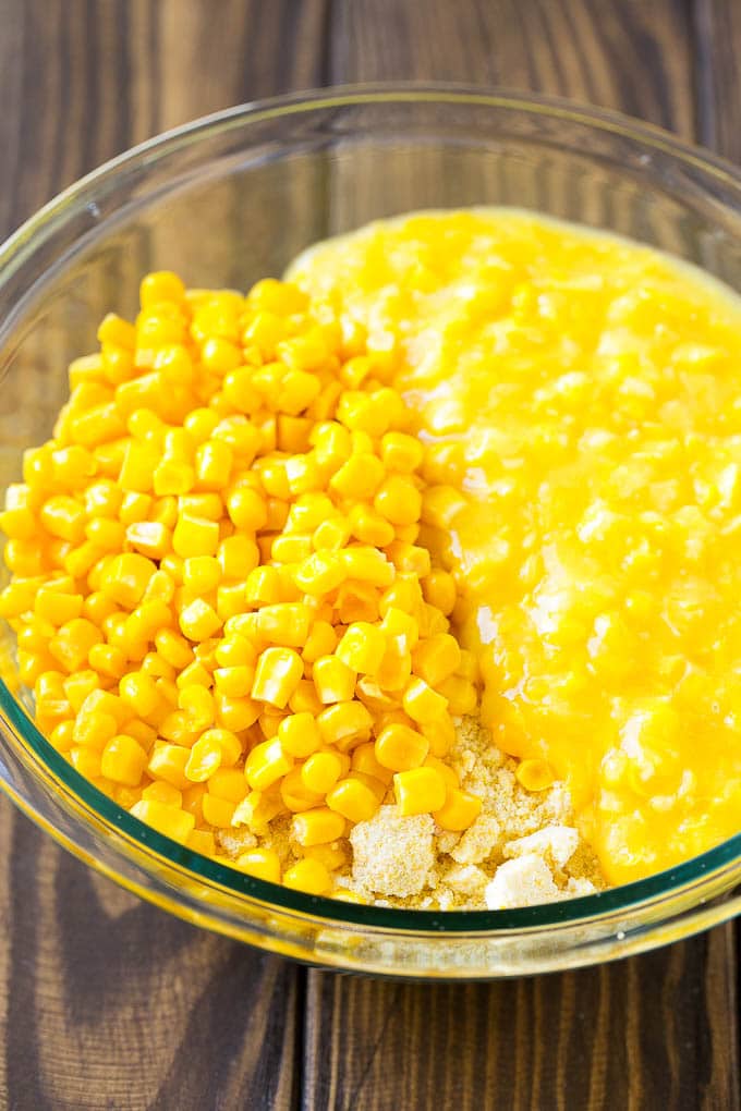 Corn kernels, creamed corn and cornbread mix in a bowl.