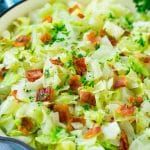 Fried cabbage with bacon, onions and parsley.
