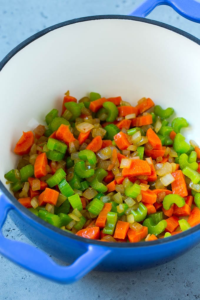 Onion, carrot and celery in a soup pot.