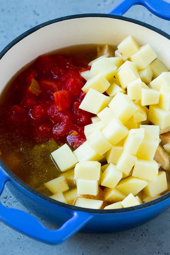 Mexican chicken soup with diced potatoes, tomatoes, chicken and vegetables.