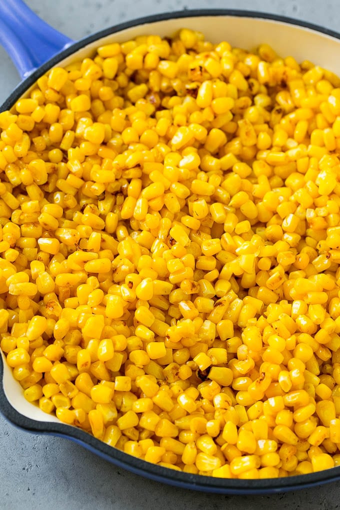 Sauteed corn in a skillet.