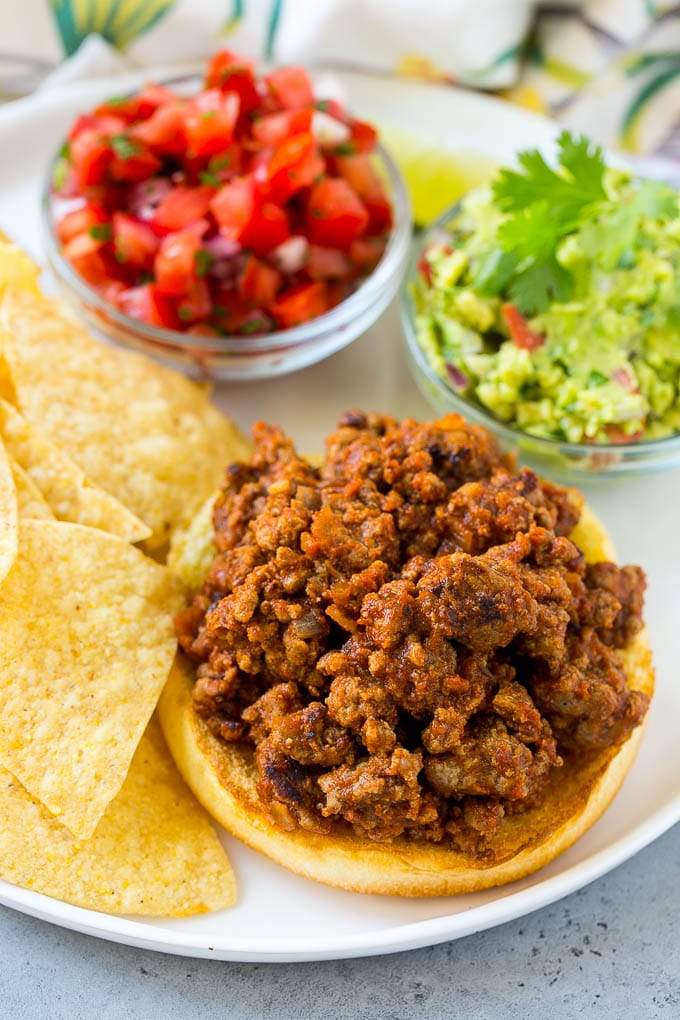 Sloppy joe meat on top of a hamburger bun.