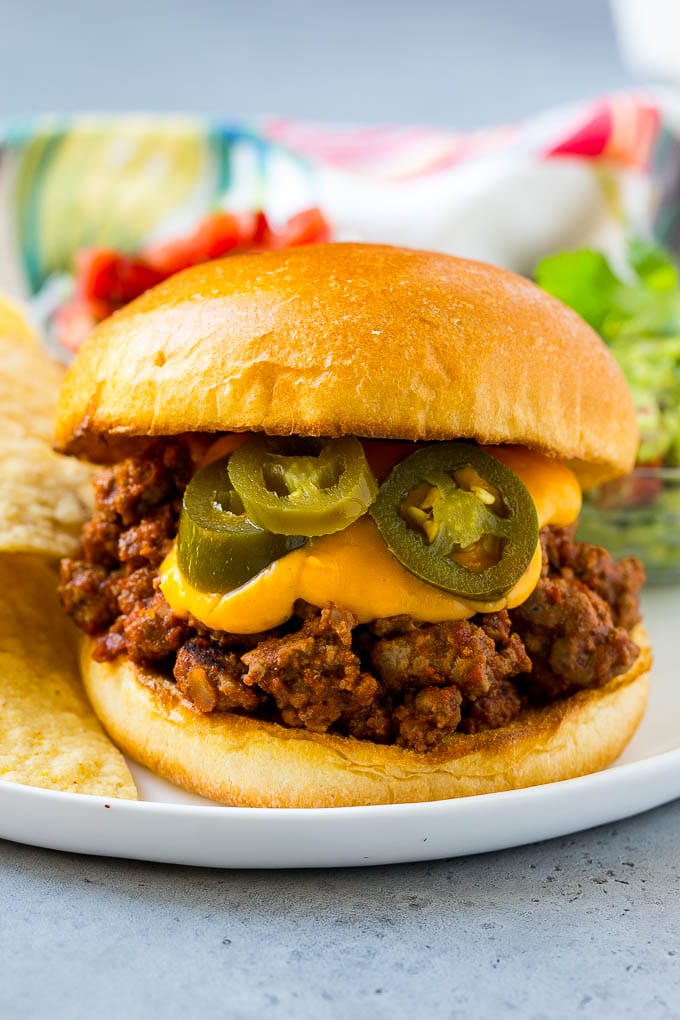 Nacho sloppy joes with ground beef, cheese sauce and jalapenos.