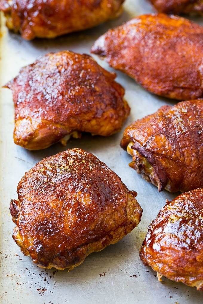 Smoked chicken thighs on a sheet pan.