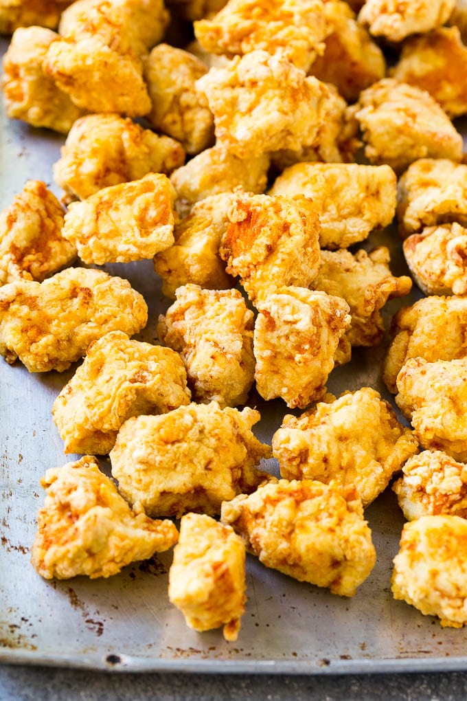 Sweet Chili Chicken Recipe | Thai Chicken | Asian Chicken #chicken #thaifood #chili #dinner #dinneratthezoo Fried chicken breast pieces on a sheet pan.