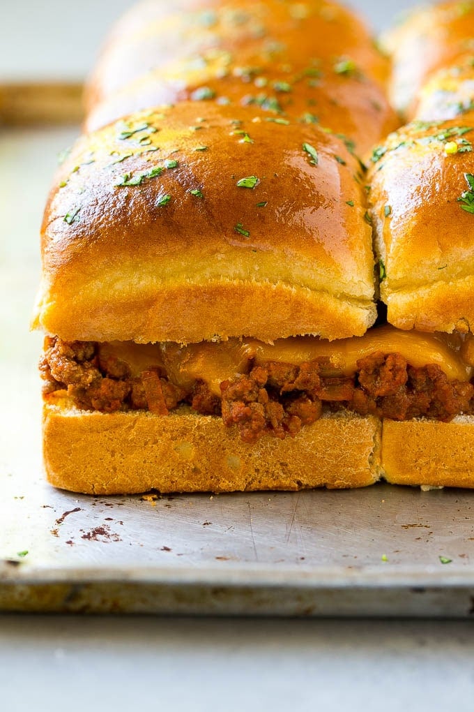 Ground beef and melted cheddar cheese on slider buns.