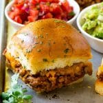 Taco sliders with salsa and guacamole on the side.