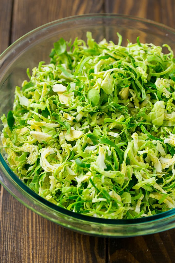 Shredded sprouts in a glass bowl.