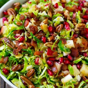 Brussels sprout salad with shredded brussels sprouts, pomegranate, pecans, feta cheese, apples and bacon.