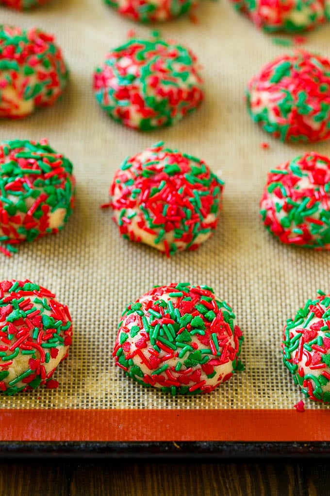 Balls of cake mix cookie dough rolled in sprinkles.