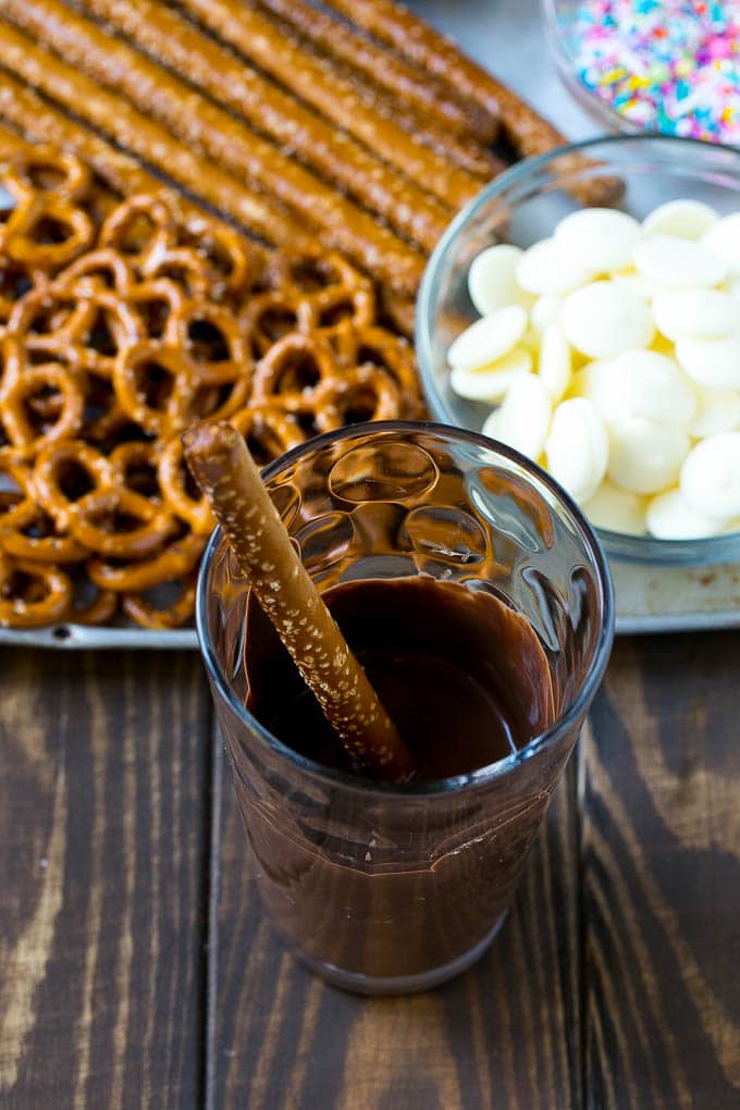 A rod in a glass full of melted chocolate.