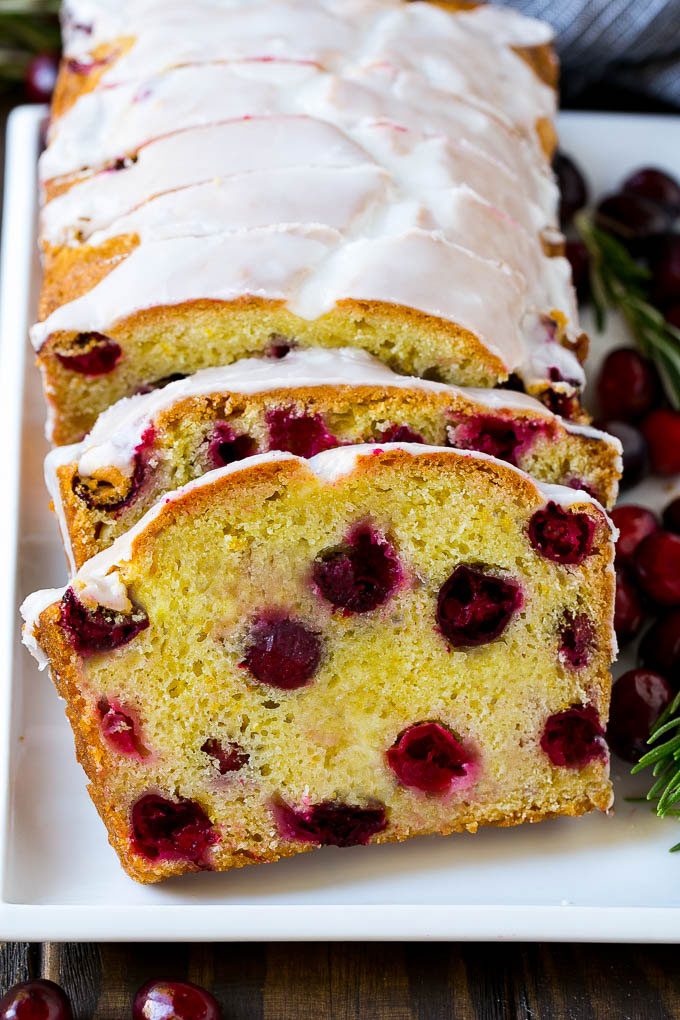 Slices of cranberry bread topped with orange glaze.