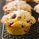 Baked cranberry muffins topped with streusel.