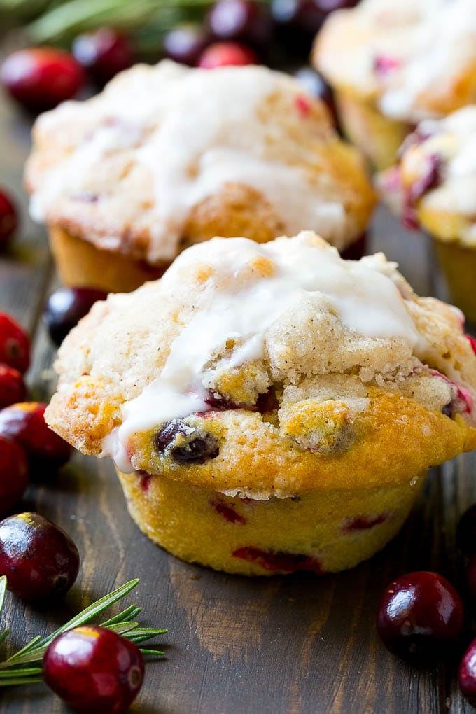 Cranberry muffins topped with streusel and orange glaze.