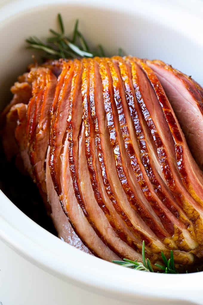 A spiral cut crock pot ham inside a slow cooker.