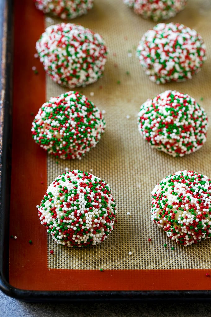 Balls of gooey butter cookie dough rolled in sprinkles.