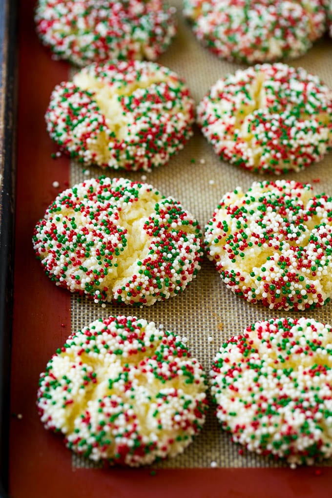 Baked gooey butter cookies on a sheet pan.