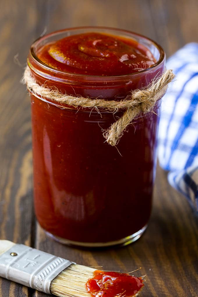 A jar of homemade BBQ sauce made with ketchup, vinegar, brown sugar and spices.