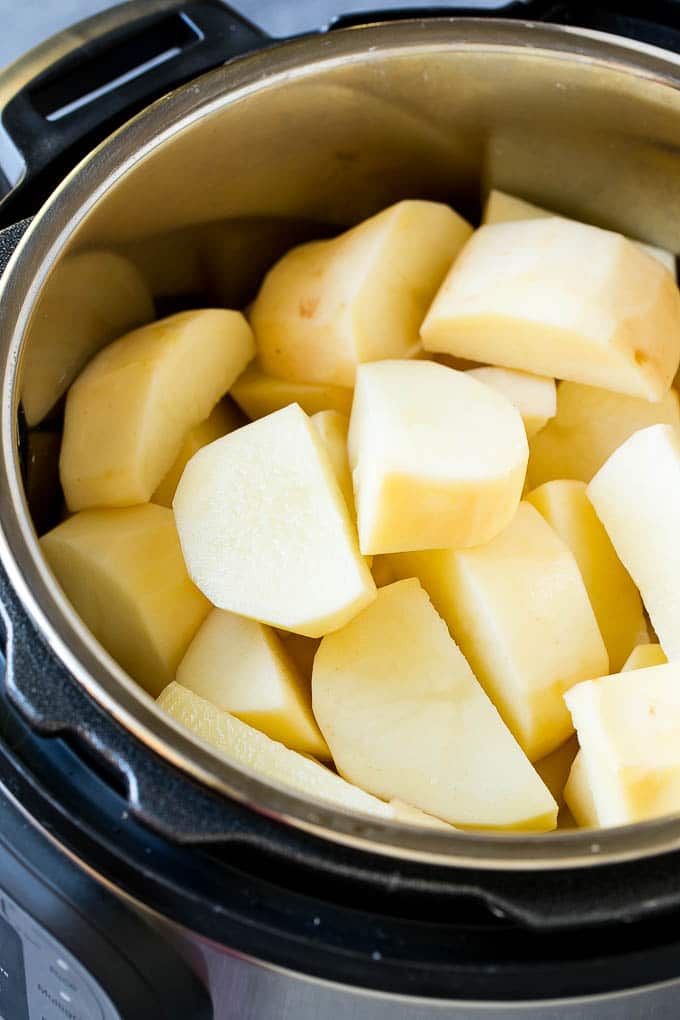 Instant Pot Mashed Potatoes Recipe | Pressure Cooker Mashed Potatoes | Easy Mashed Potatoes #potatoes #sidedish #instantpot #thanksgiving #dinner #dinneratthezoo Peeled potatoes in an Instant Pot.