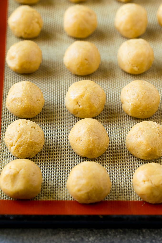 Balls of dough on a baking sheet.