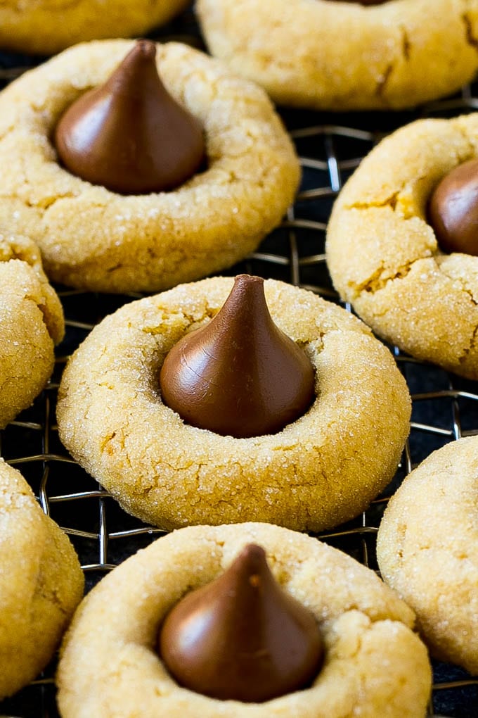 Peanut butter blossom cookies on a cooling rack.