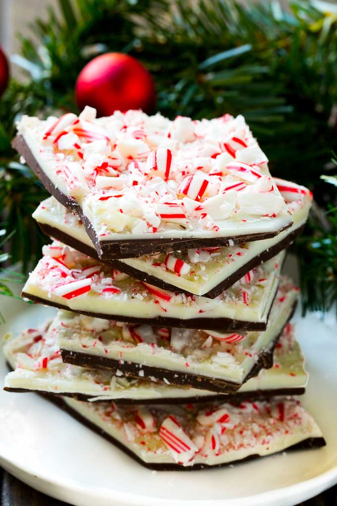 A stack of peppermint bark pieces on a plate.