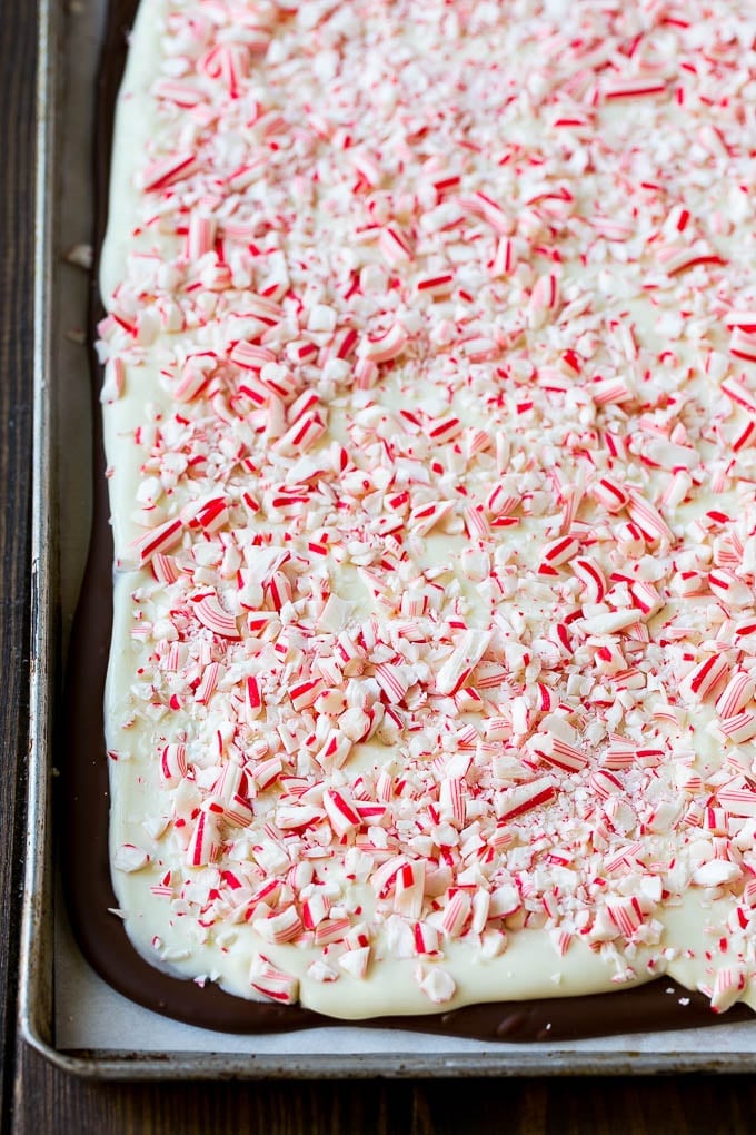 A layer of white chocolate and crushed candy canes on top of semisweet chocolate.