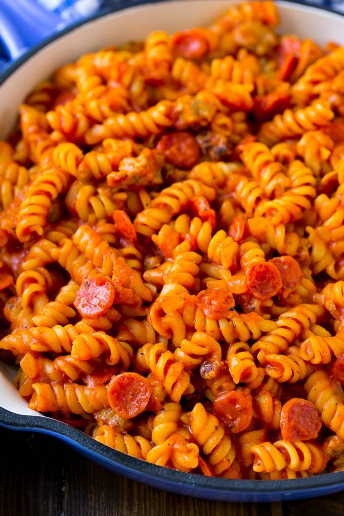 Rotini pasta cooked with pepperoni and tomato sauce.