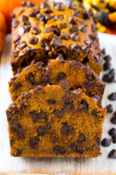 Sliced pumpkin chocolate chip bread on a serving board.