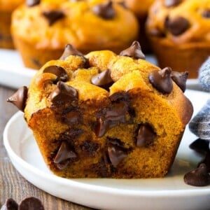 A cross section of a pumpkin chocolate chip muffin.
