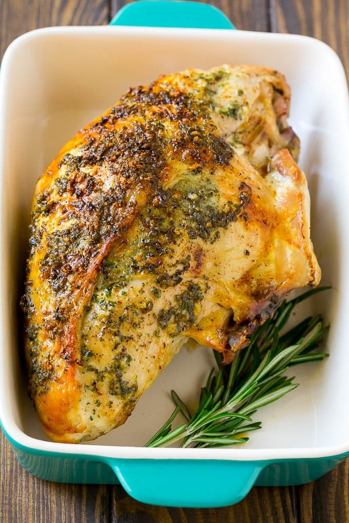 A roasted turkey breast in a baking dish.