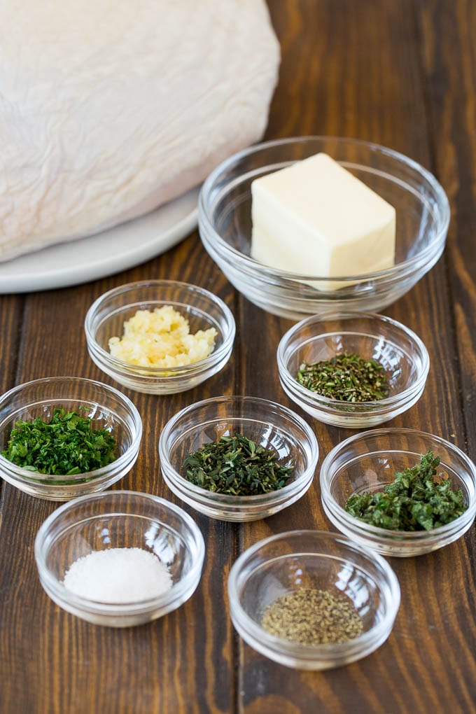 Ingredients including bowls of butter, garlic and herbs.