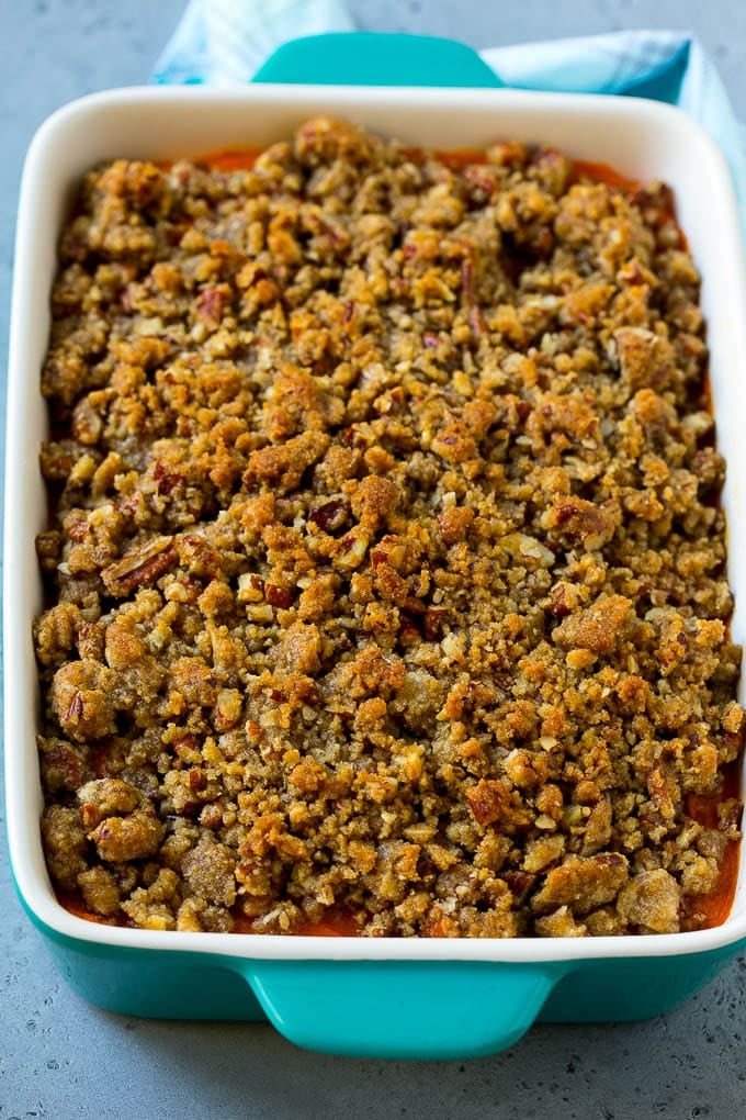 A baking dish of Ruth's Chris sweet potato casserole topped with streusel.