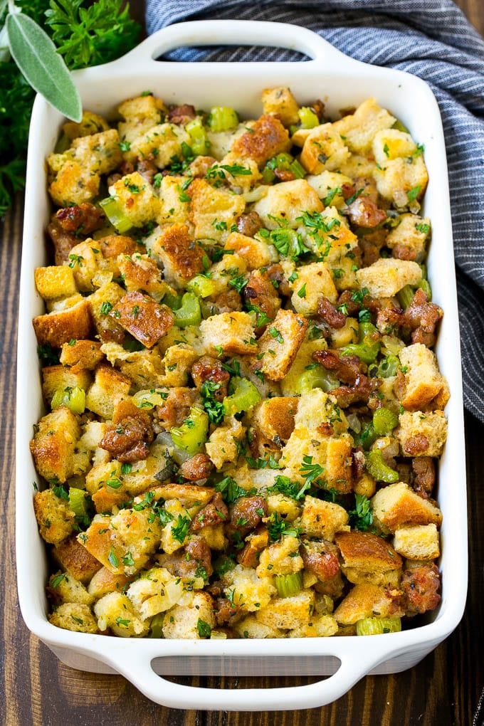 A baking dish of sausage stuffing made with Italian sausage, bread cubes and vegetables.