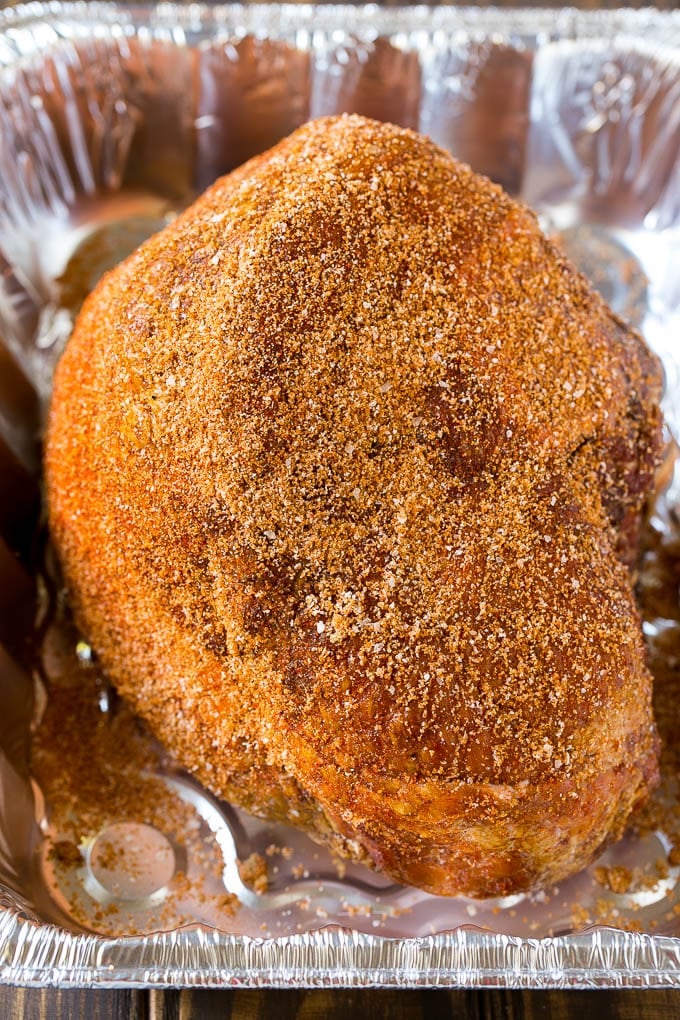 A ham crusted in homemade spice rub, ready to go into the smoker.