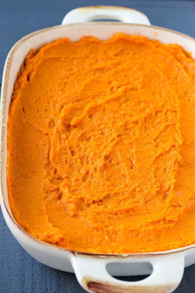 Mashed sweet potatoes in a baking dish.