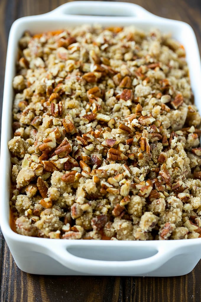 An uncooked sweet potato casserole with pecan streusel.