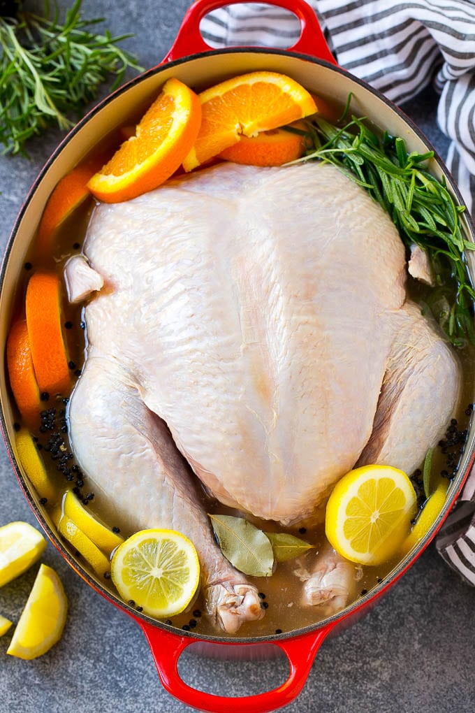 A whole turkey in turkey brine which is made with citrus, herbs and spices.