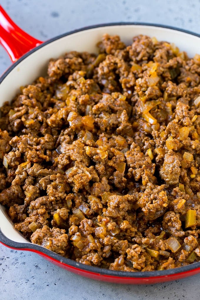 Ground beef, onions and salsa in a skillet.