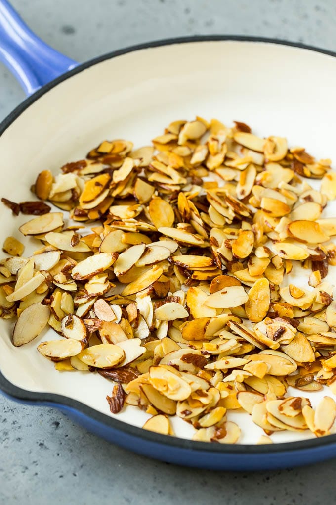 Butter toasted almonds in a skillet.