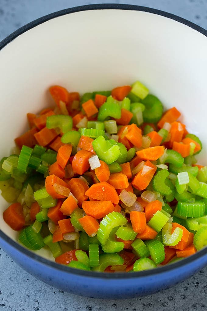 Sauteed carrot, celery and onion in a soup pot.